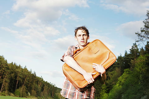 man holding leather bag, luggage, forward, young, uncertain HD wallpaper