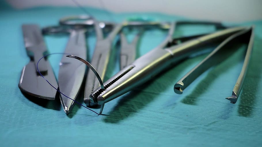 closeup photo of gray pliers set, surgery, tools, scalpel, a pair of scissors