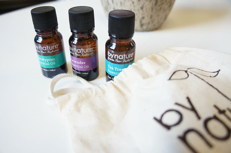 three By Nature bottles near white pouch, essential oils, lavender HD wallpaper
