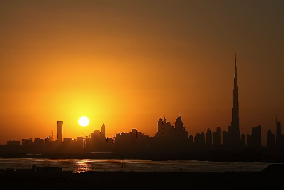 silhouette photography of cityscape, night, dubai, sunset, skyscraper HD wallpaper
