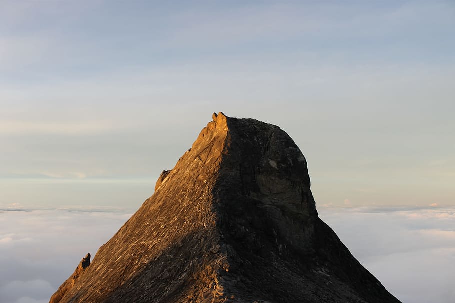 mountain, peak, sunrise, clouds, shadow, sky, rock, rock - object HD wallpaper