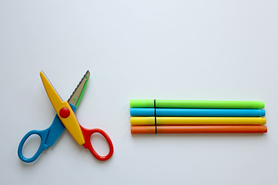 closeup photo of multicolored scissors and pens on white surface, HD wallpaper
