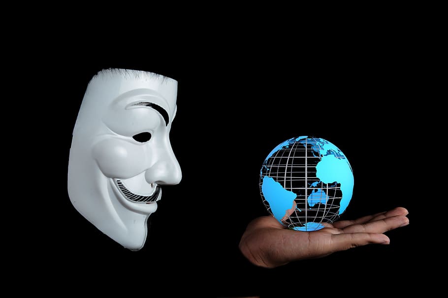 person holding globe model, anonymous, world, activist, hacktivist HD wallpaper