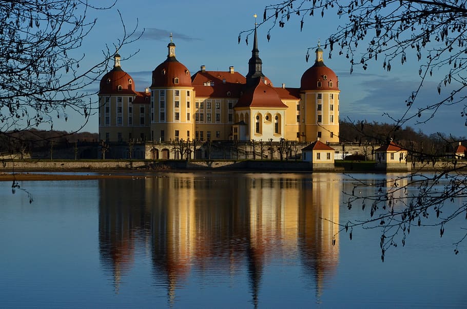 yellow and red concrete building near body of water, moritz castle HD wallpaper