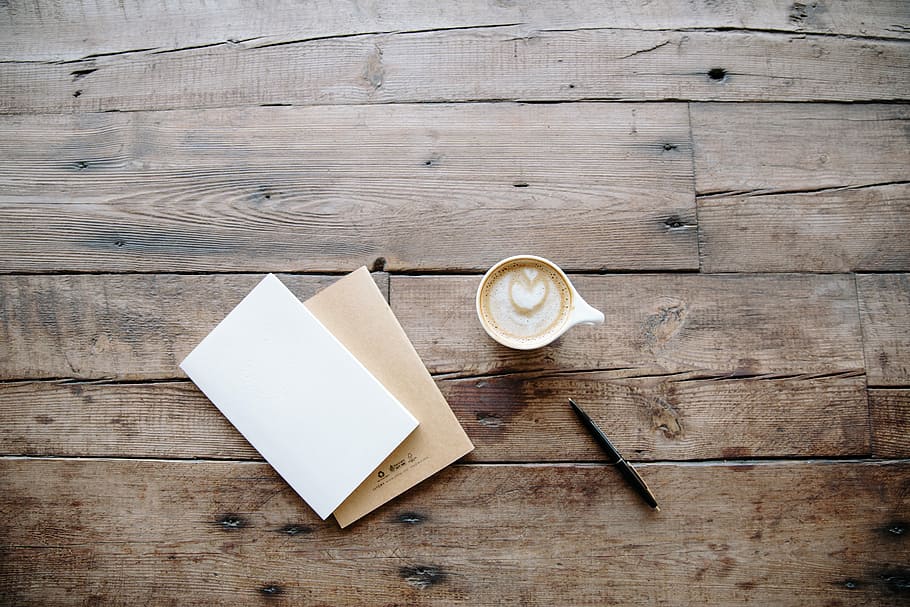 black twist pen near white teacup, white ceramic mug beside pen and paper, HD wallpaper