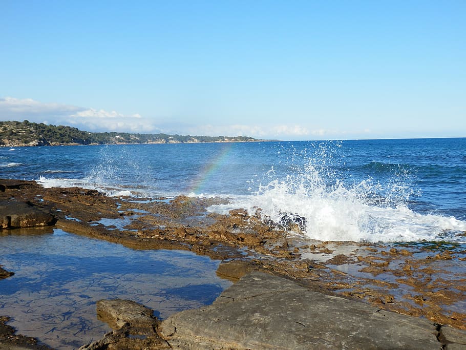 arc, iris, sea, water, rocks, wave, wind, splash, sky, beauty in nature HD wallpaper