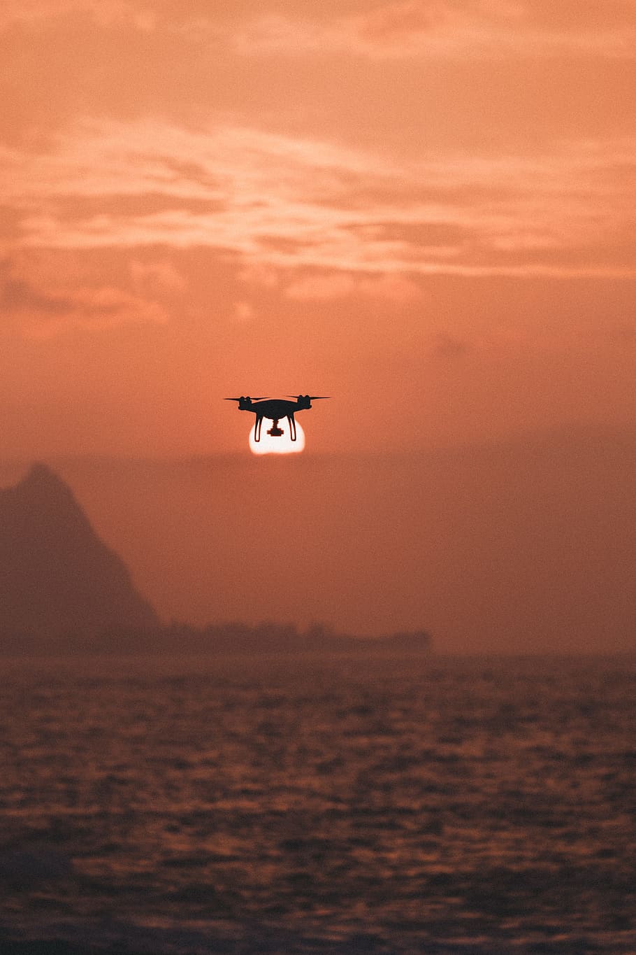 silhouette of drone hovering above body of water, black quadcopter under ocean HD wallpaper
