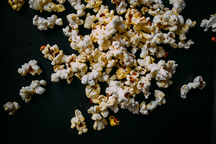 Popcorn, popcorn lot on black textile, food, snack, butter, freshness HD wallpaper
