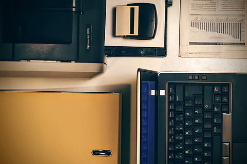 opened black laptop computer near stamp, printer, office, folder HD wallpaper