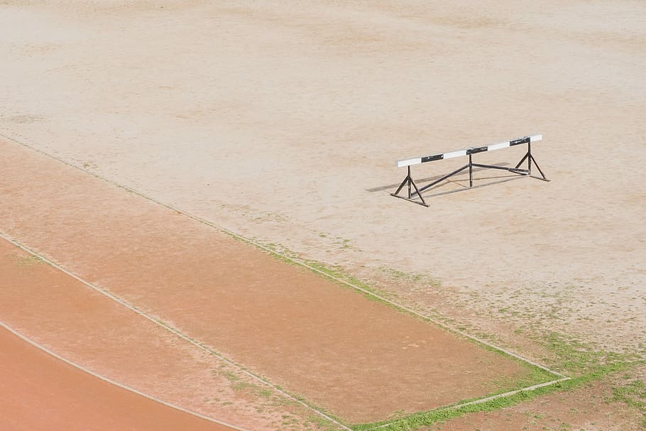 black and white hurdle on file, white and black bar on brown oval track HD wallpaper