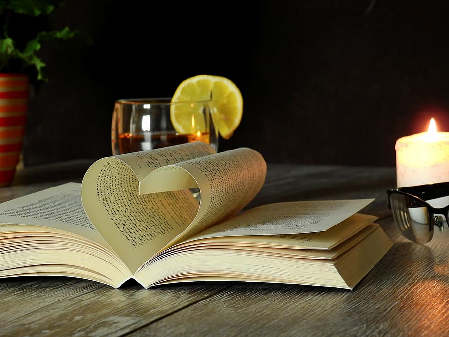 brown book page near candle, read, literature, learn, text HD wallpaper
