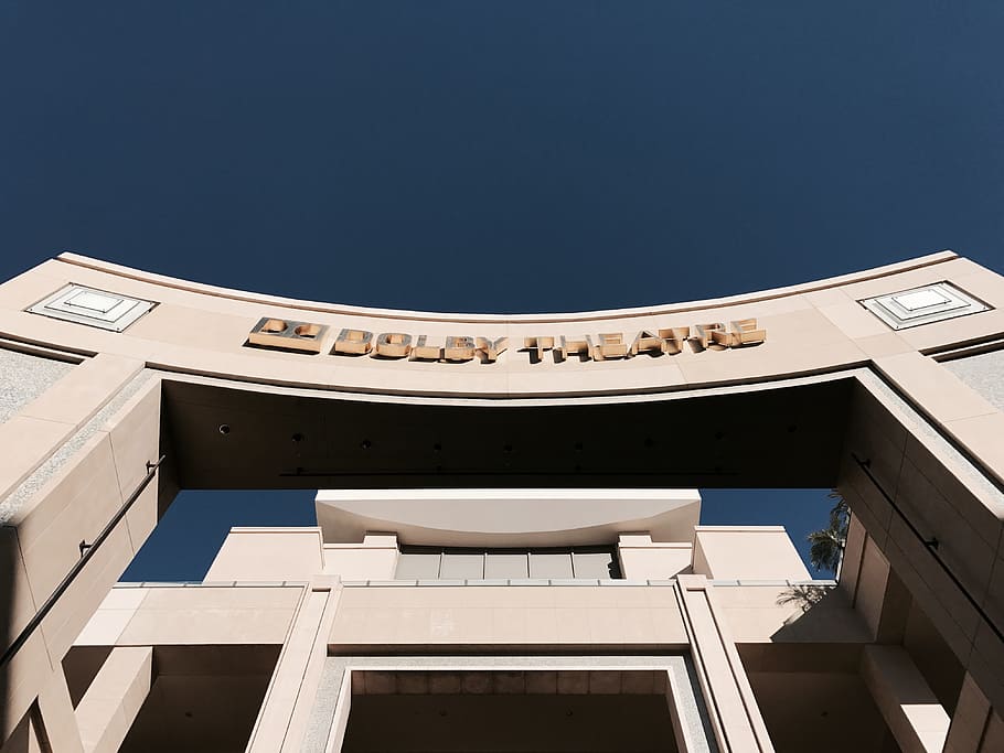 brown concrete structure, low-angle photo of Dolby Theater arch during daytime HD wallpaper
