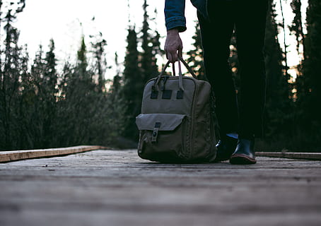 person standing on road while carrying backpack, person carrying gray bag HD wallpaper