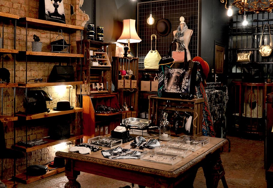 assorted items at the shop, assorted-type of jewelries on square brown wooden table beside brown wooden rack HD wallpaper
