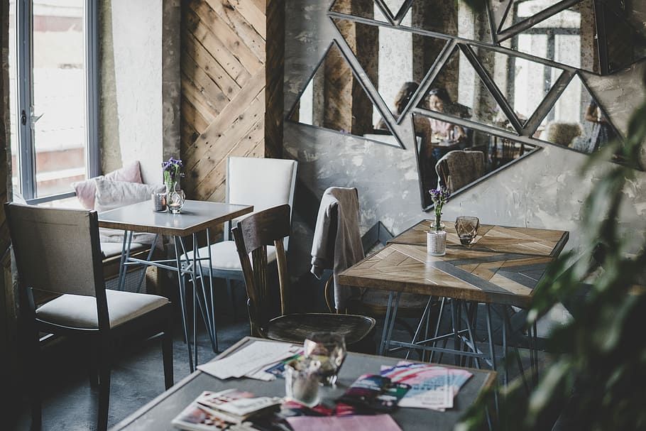 square brown wooden table beside mirror on wall, empty restaurant during daytime HD wallpaper