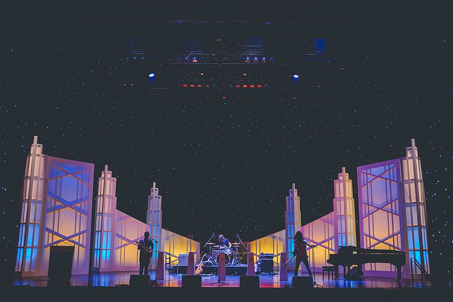 music band playing on stage, silhouette of person standing near wall HD wallpaper