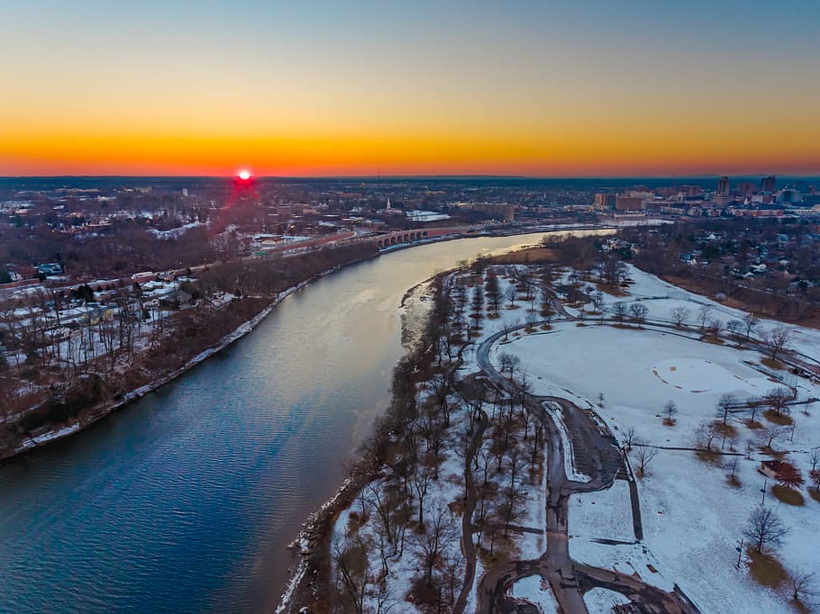 river during sunset, aerial photo of river beside trees during golden hour HD wallpaper
