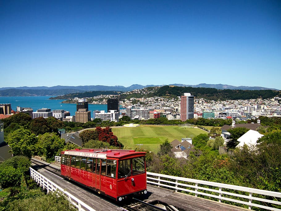 photo of red tram on bridge during daytime, wellington, new zealand, HD wallpaper