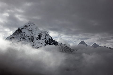 landscape photography of mountain cover by snow, mountain covered by snow surrounded by stratus clouds HD wallpaper