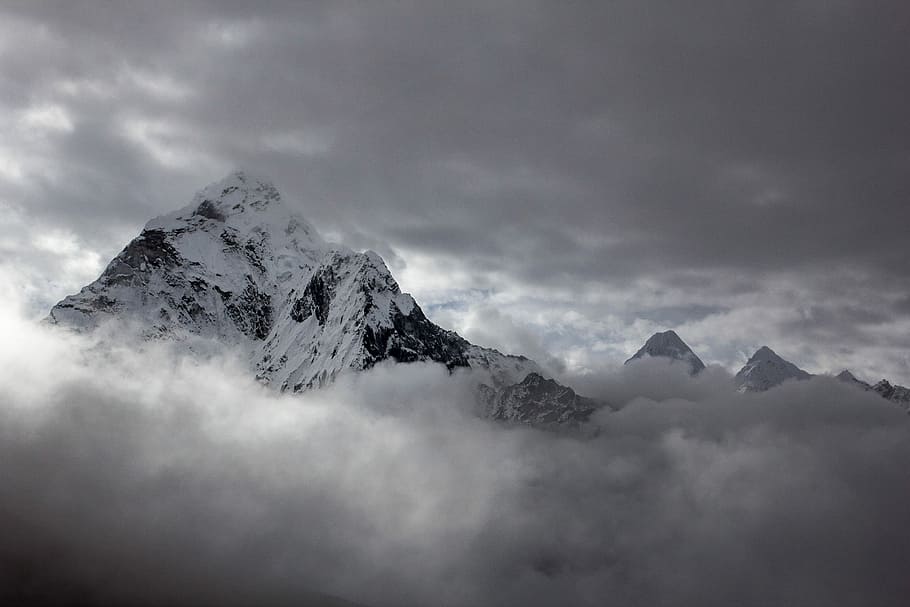 landscape photography of mountain cover by snow, mountain covered by snow surrounded by stratus clouds HD wallpaper