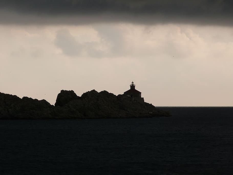 stormy, lighthouse, dramatic, clouds, sea, dark, sky, water HD wallpaper