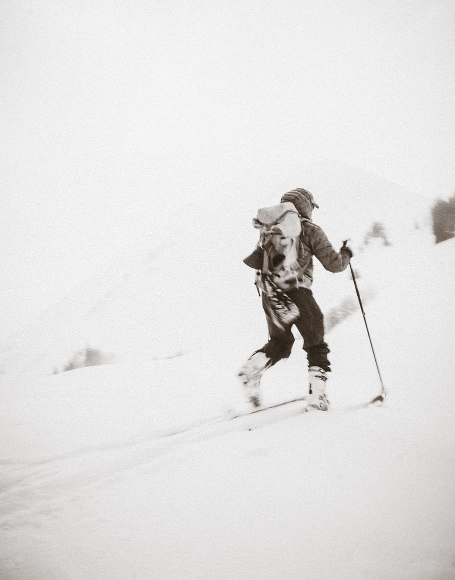person hiking in snow mountain, grayscale photo of a person skiing on snow HD wallpaper