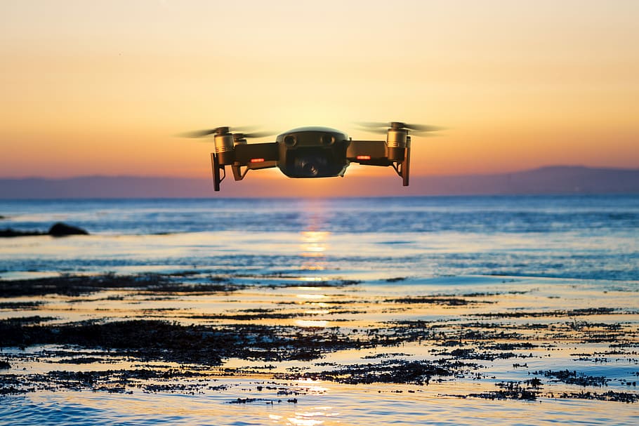 flying quadcopter drone, brown quadcopter flying during sunset, HD wallpaper