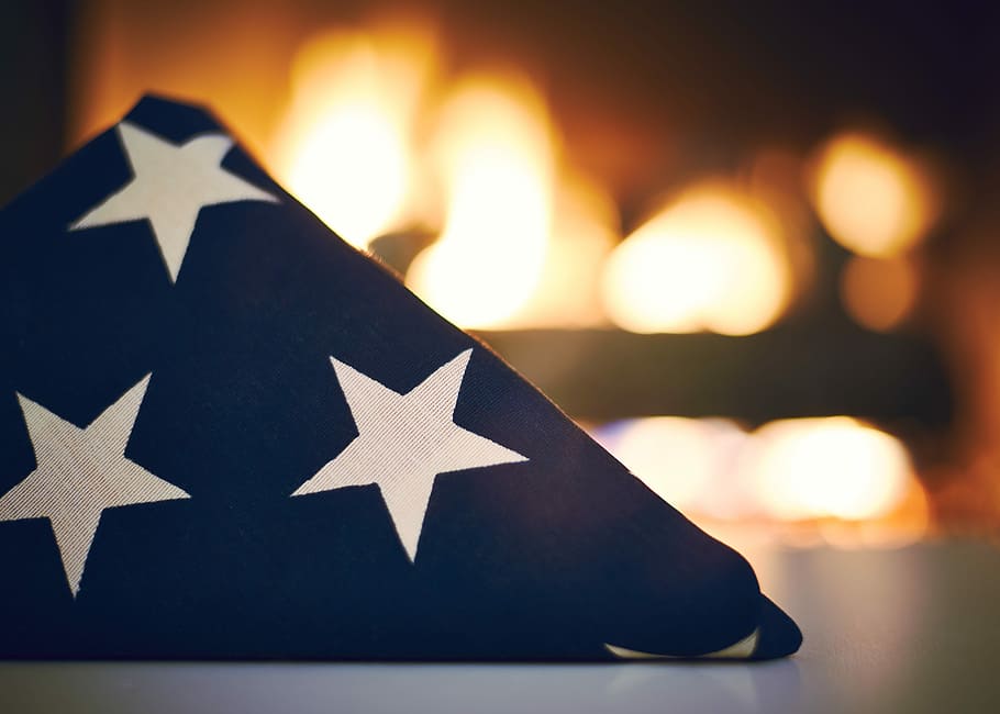 blue and white star print textile in front of bonfire, folded American flag, HD wallpaper