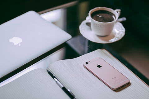 rose gold iPhone 6s on top of graphing book, laptop, computer HD wallpaper