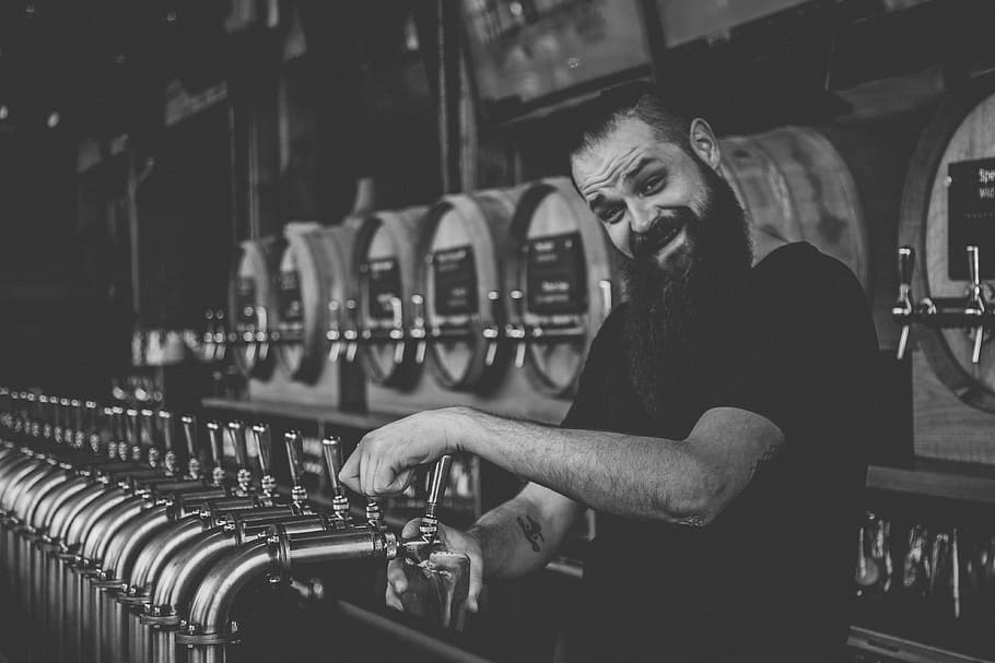 male bartender, grayscale of smiling man on beverage dispenser HD wallpaper