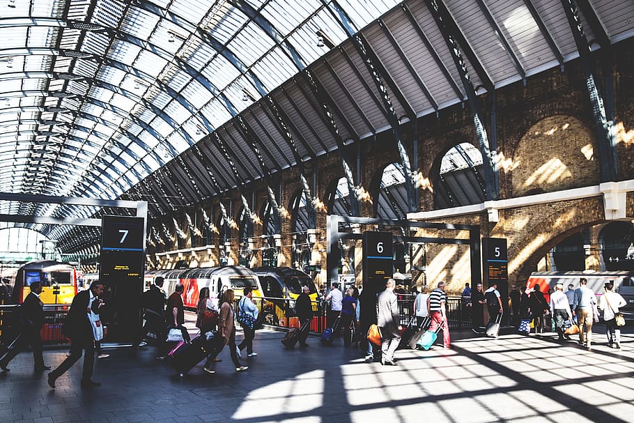 Train passengers at a busy railway station at Kings Cross in Central London. Image captured with a Canon 6D DSLR, HD wallpaper