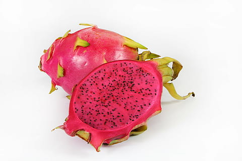 ripe dragon fruit sliced in half on white surface, red, healthy eating HD wallpaper