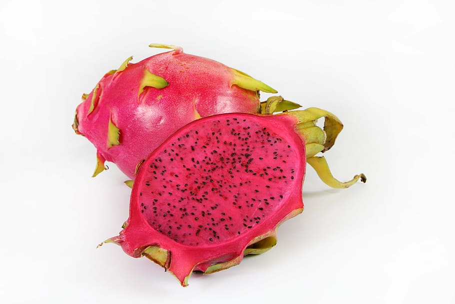 ripe dragon fruit sliced in half on white surface, red, healthy eating HD wallpaper