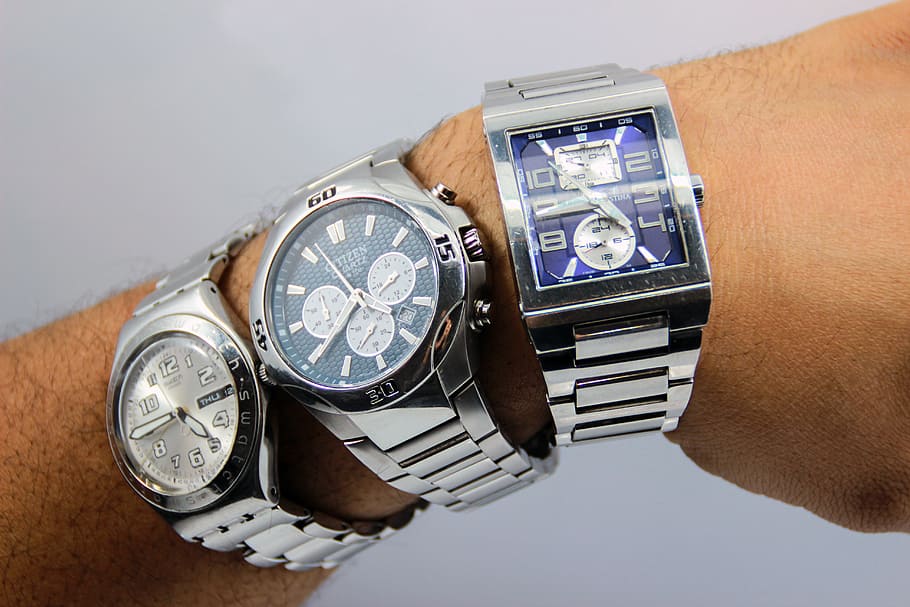 person wearing three silver-colored chronograph watches, clock HD wallpaper