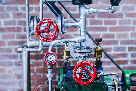 Gray Gold and Red Industrial Machine, brass, brick wall, close -up HD wallpaper