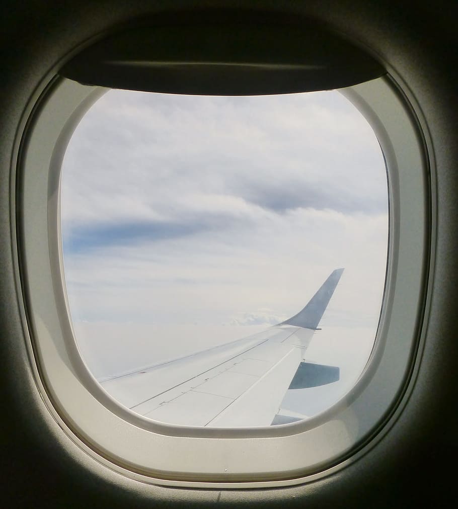 white airplane near nimbus clouds, window, window seat, aircraft