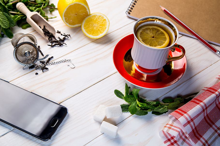 smartphone beside ceramic mug on wooden table, tea, grass, sheet HD wallpaper