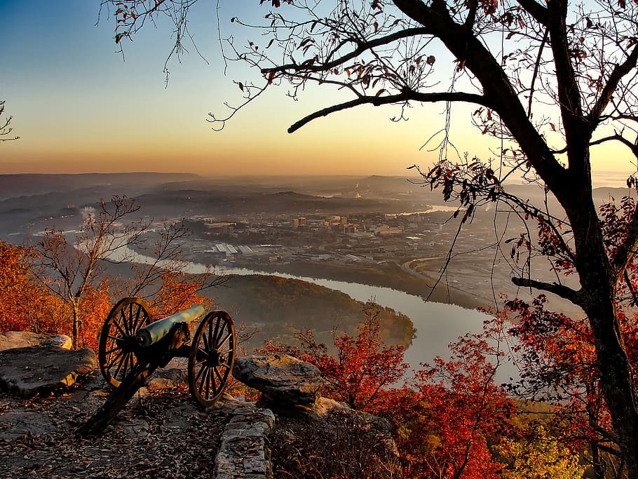 photo of black cannon on top of mountain facing city, chattanooga