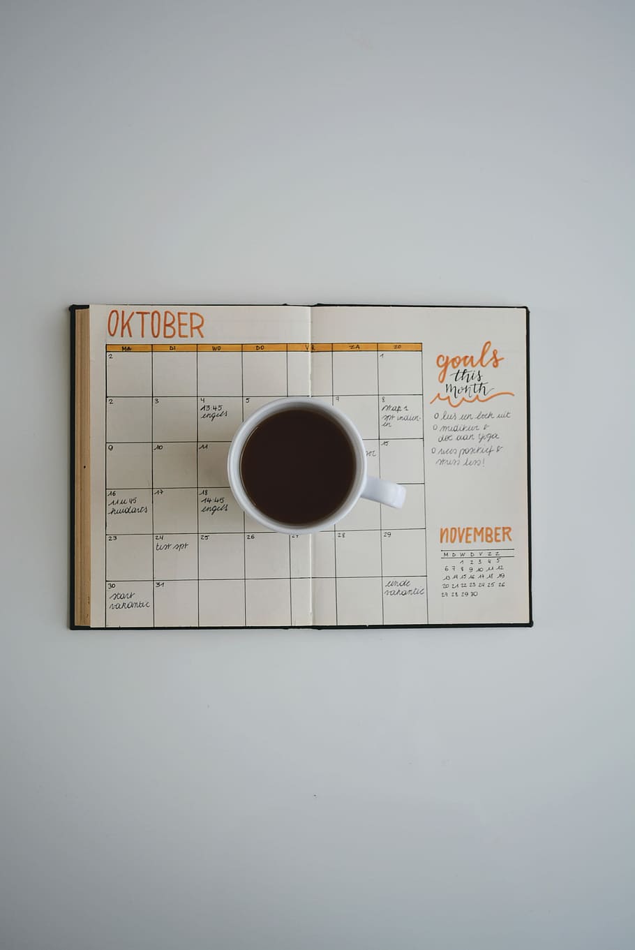 white coffee mug on calendar at october, white cup of coffee on oktober calendar HD wallpaper