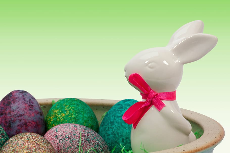 white ceramic rabbit and eastern egg decor, easter nest, easter bunny