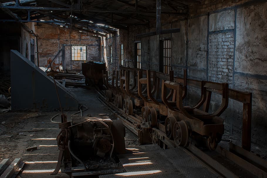 brown steel mining train on railroad, mine, urbex, abandoned