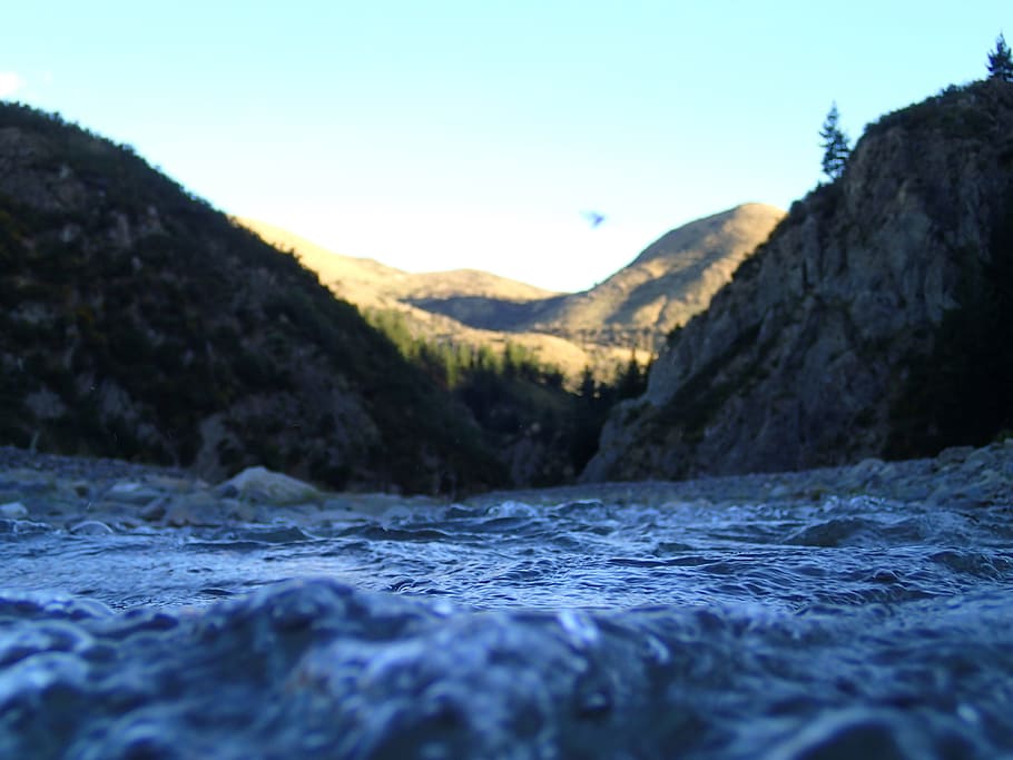 worm's eye-view photo of valley, body of water in the middle of mountain during daytime HD wallpaper