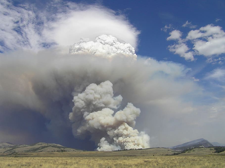 gray gloomy sky above green grass field, fire, smoke, explosion HD wallpaper