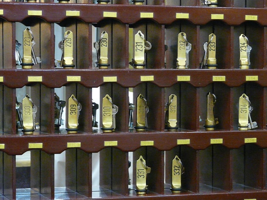 gold components on brown cubby shelf, hotel, key, key counter HD wallpaper
