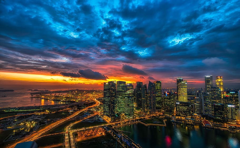 skyscraper during golden hour, high angle photography of lighted buildings HD wallpaper