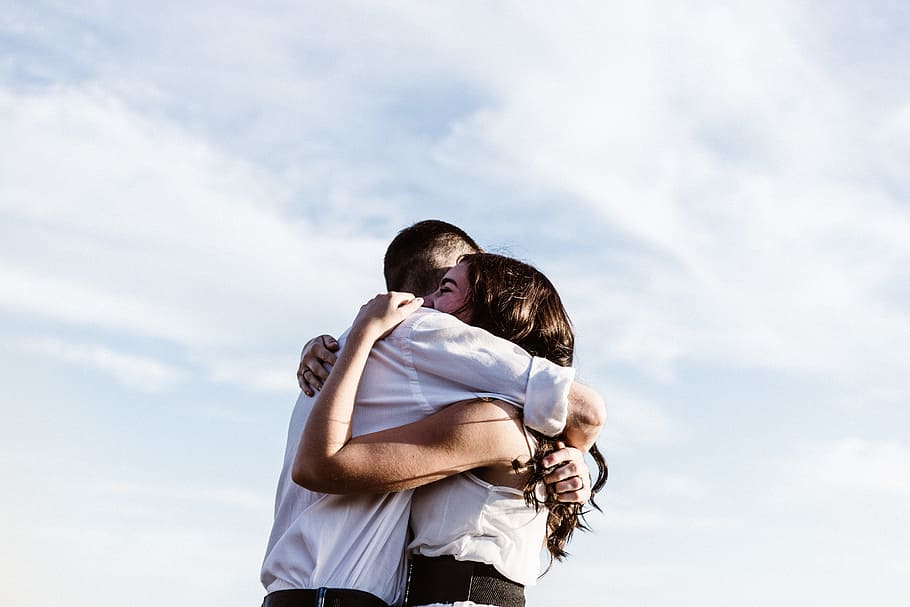 man and woman hugging each other photography, man wearing white dress shirt embracing woman wearing white tank top, HD wallpaper