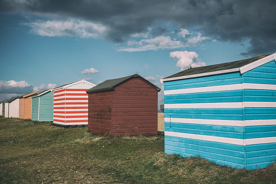 Wide angle shot of colourful beach huts on the coast of Kent in England. Image captured with a Canon 5D HD wallpaper