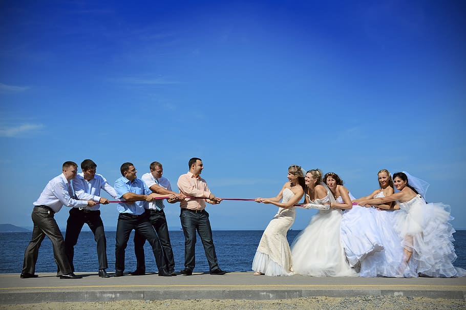 bride and groom acting playing tug of war, sports, rope, vapor