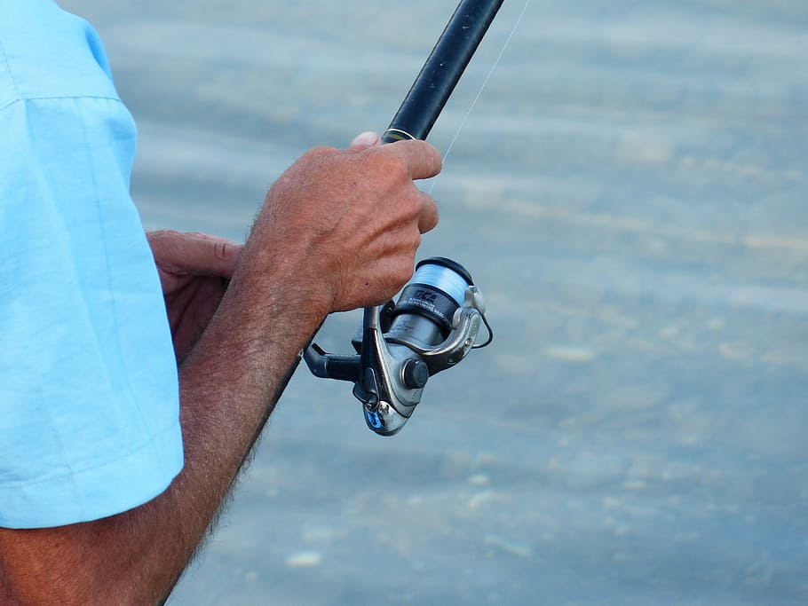 person holding black fishing reel, angel, angler, telescopic rod, HD wallpaper