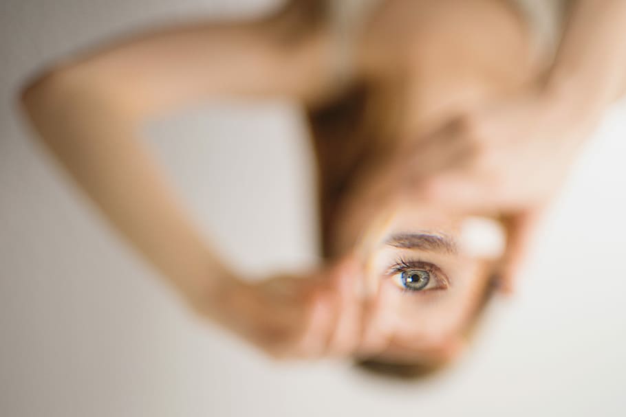 woman holding mirror, human eye, reverse, lens, macro, upside down HD wallpaper
